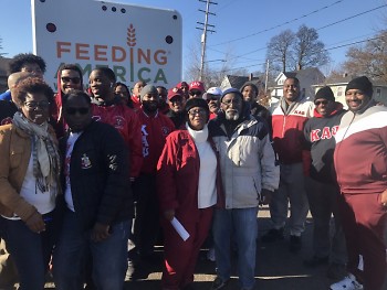 Beverly, Tyrone and volunteers, including those from Kappa Alpha Psi.