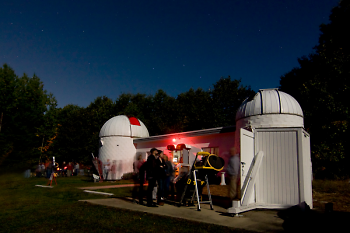 Veen Observatory visitors in line for a portable telescope viewing, during a previous year.