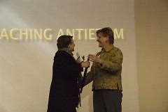 Grand Rapids Historical Society President Gina Bivins presents Baxter Award to Rebecca Smith-Hoffman at Gerald R. Ford Museum 