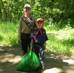 Bradlee Gehlhoff, a second-grader, shows off the bag filled with invasive garlic mustard.