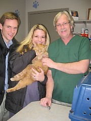 Michelle Hoey-Heath, husband Jay, and Dr. Bradfrod Lemke of Plymouth Road Animal Clinic after Gerard's checkup.