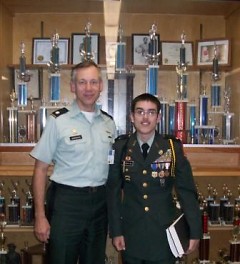 LTC Ron Janowski (Instructor) with cadet LTC Anthony Alcantar pictured in front of some of the program's many trophies