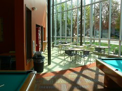 The sun streaming into the games room in the Steil Club on Straight Ave. NW