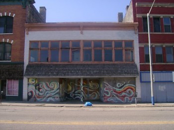 This picture was taken of 217 S. Division two months before Mr. Erkfitz created the mural. The spot is uninhabited at the moment